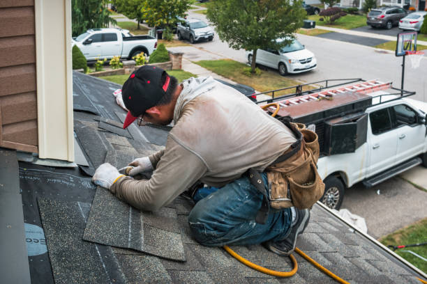 Professional Storm Damage Roof Repair technician working in Flora, IN